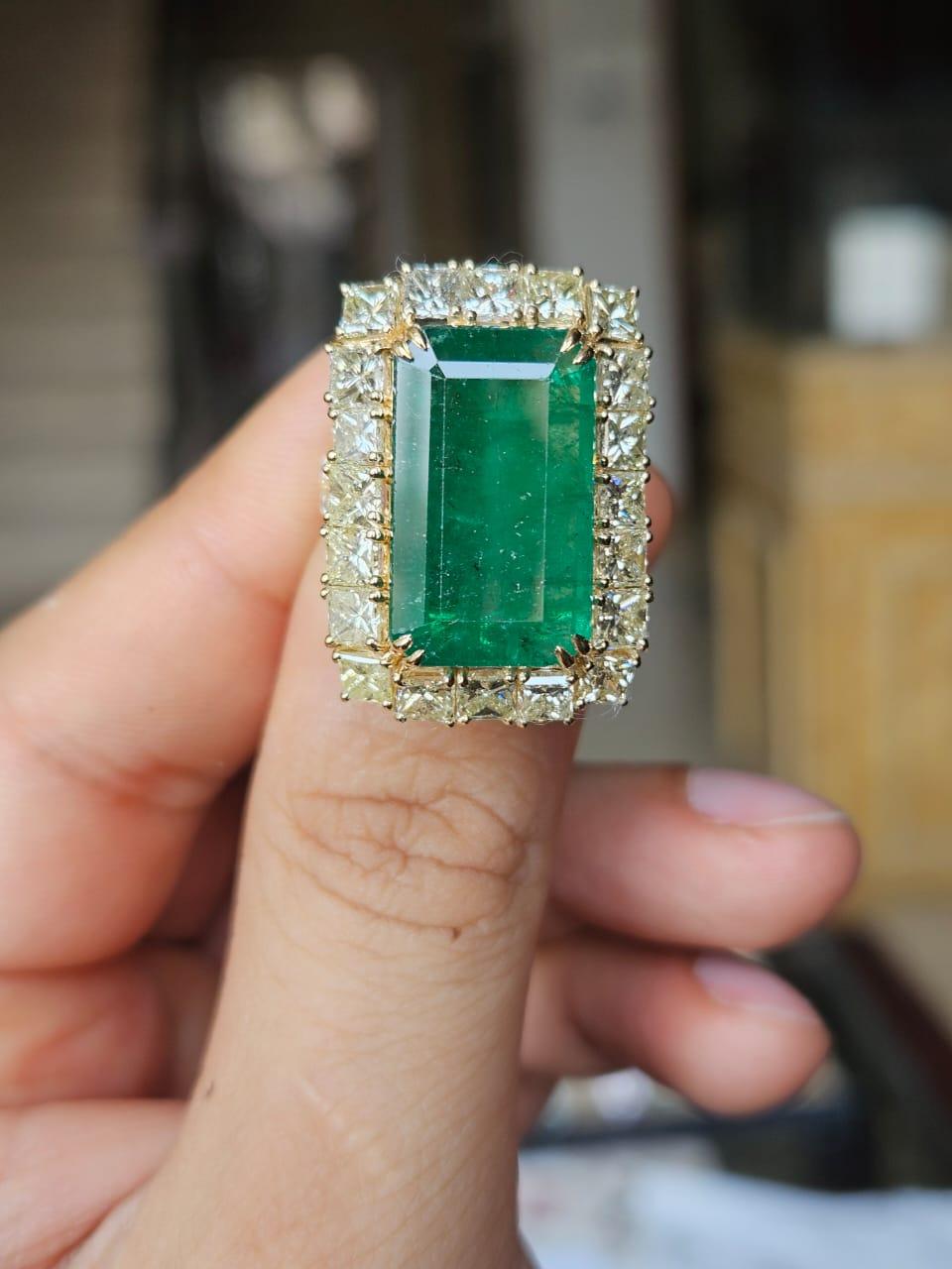 A very gorgeous and beautiful, classical style, Emerald Cocktail Ring set in 18K Yellow Gold & natural Diamonds. The weight of the Emerald is 11.08 carats. The Emerald is completely natural, without any treatment and is of Zambian origin. The