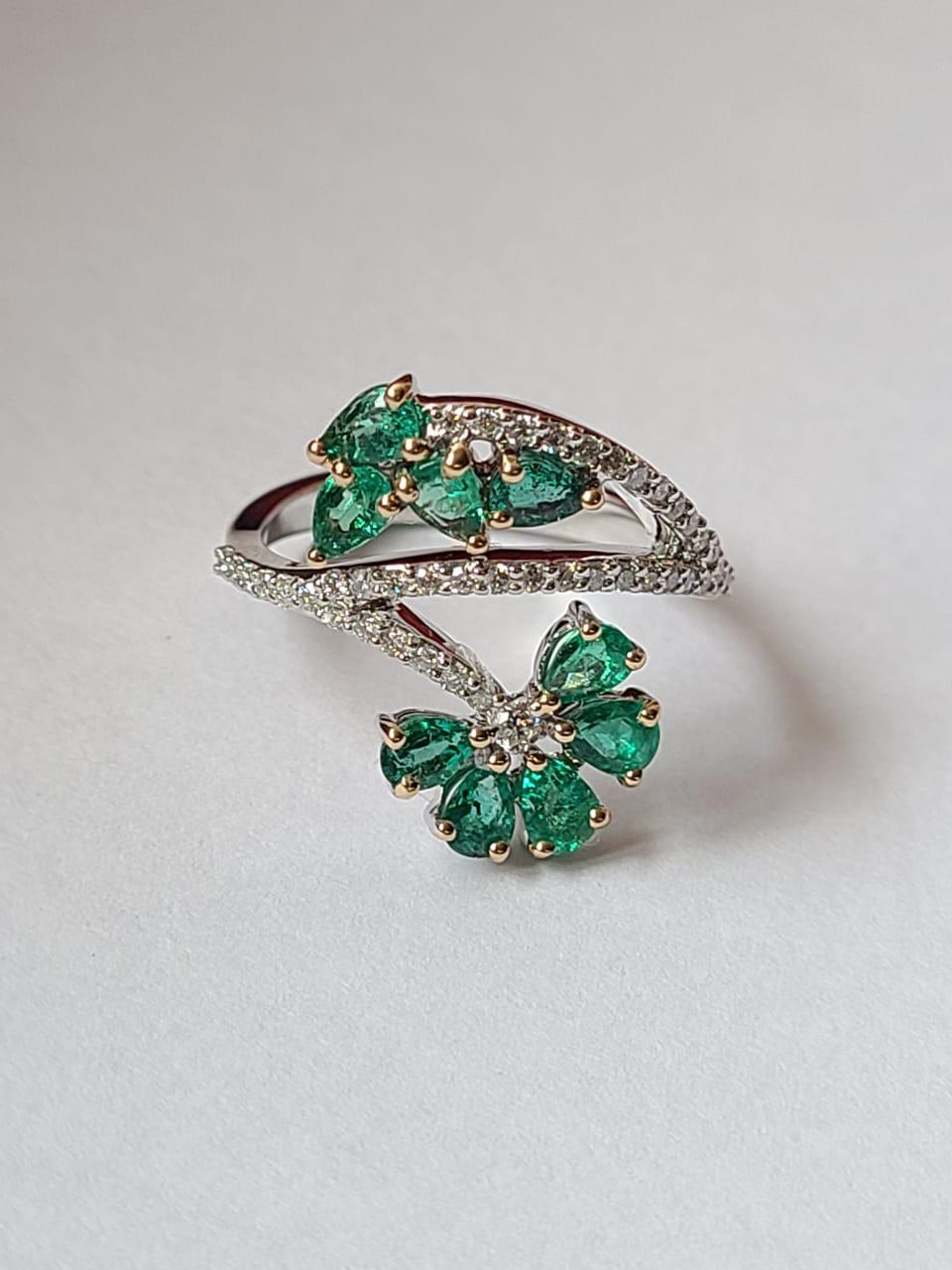 A very beautiful Emerald Cocktail Ring set in 18K Gold & Diamonds. The weight of the pear shaped Emeralds is 1.13 carats. The Emeralds are of Zambian origin, and are completely natural, without any treatment. The weight of the Diamonds is 0.32