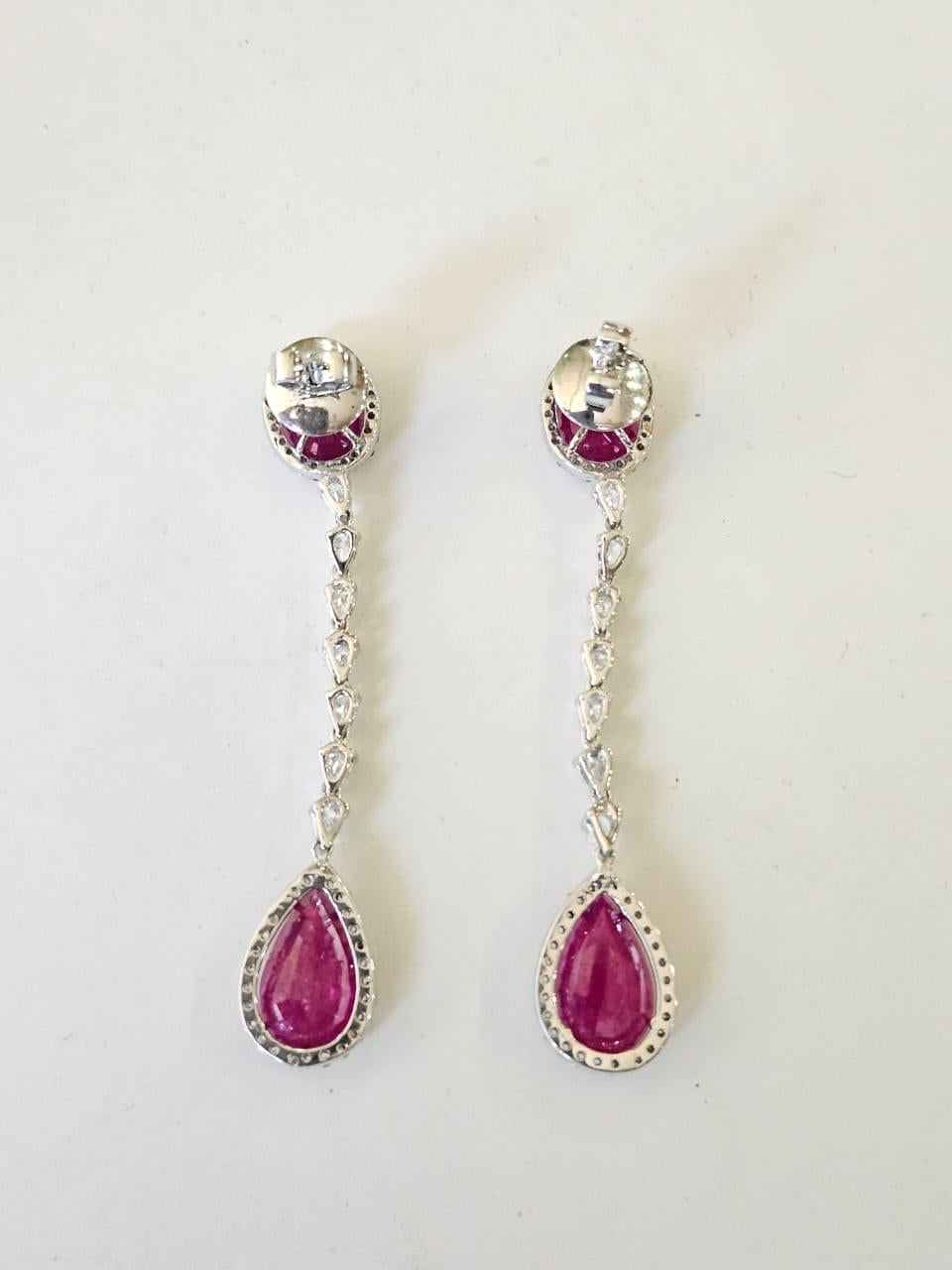A very gorgeous and beautiful, modern style, Ruby Chandelier Dangle Earrings set in 18K White Gold & natural Diamonds. The combined weight of the Rubies is 11.36 carats. The Rubies are completely natural, without any treatment and are of Mozambique