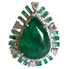 Set in 18K Gold, 11.40 Carats Natural Zambian Emerald 
Diamonds Engagement Ring