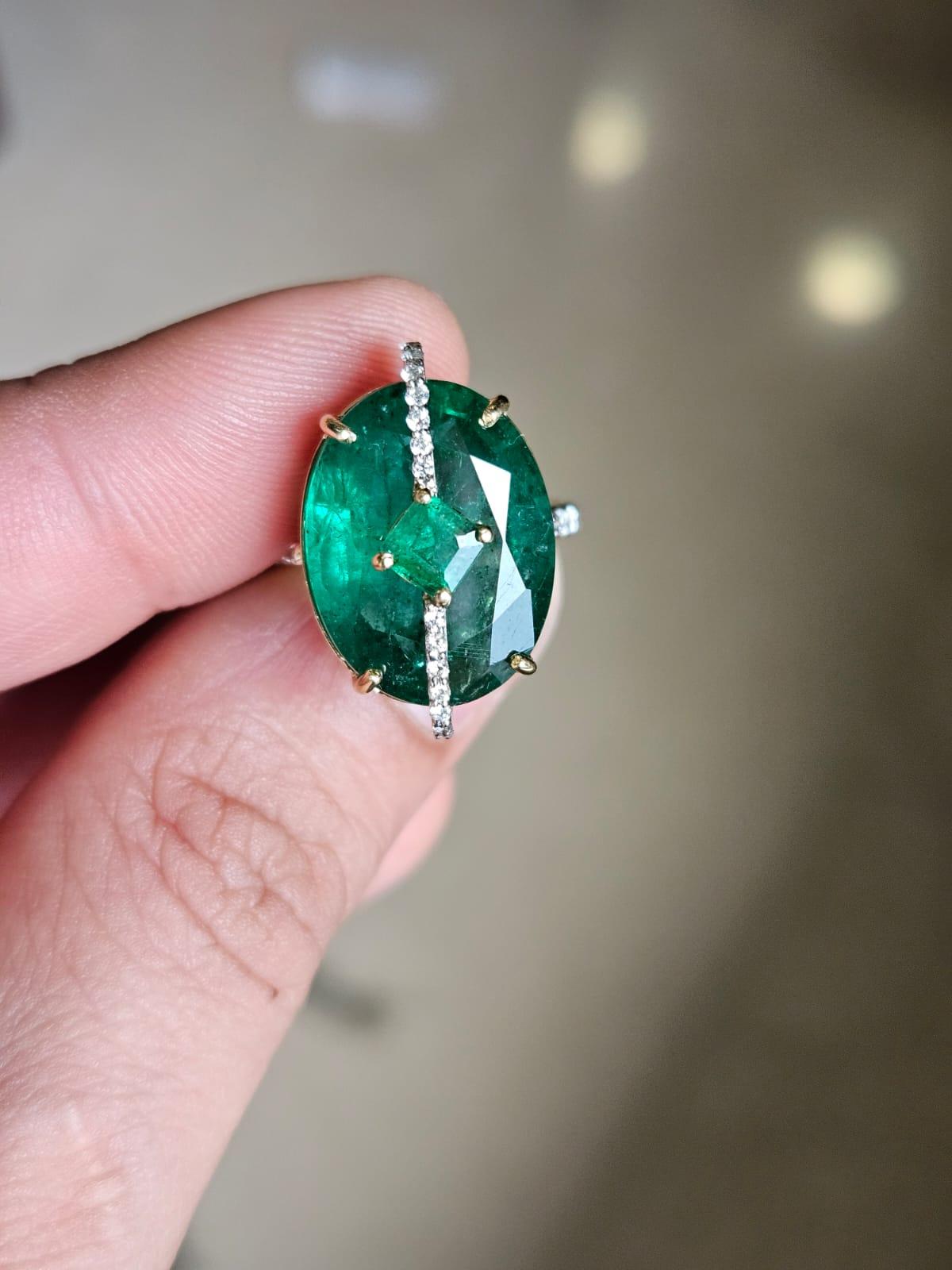 A very gorgeous and beautiful, modern style, Emerald Engagement Cocktail Ring set in 18K Gold & natural Diamonds. The combined weight of the Emeralds is 11.50 carats. The Emeralds are completely natural, without any treatment and is of Zambian