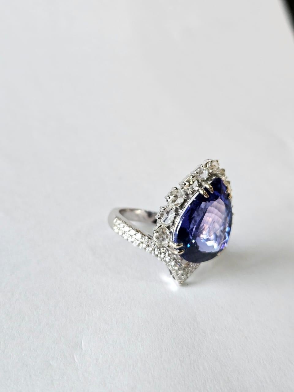 Pear Cut Set in 18K Gold, 11.75 carats, Tanzanite & Rose Cut Diamonds Engagement Ring For Sale