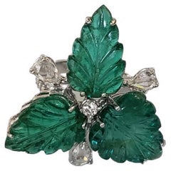 Set in 18K Gold, 13.00 carats carved Emerald & Diamond Three Stone/Cocktail Ring