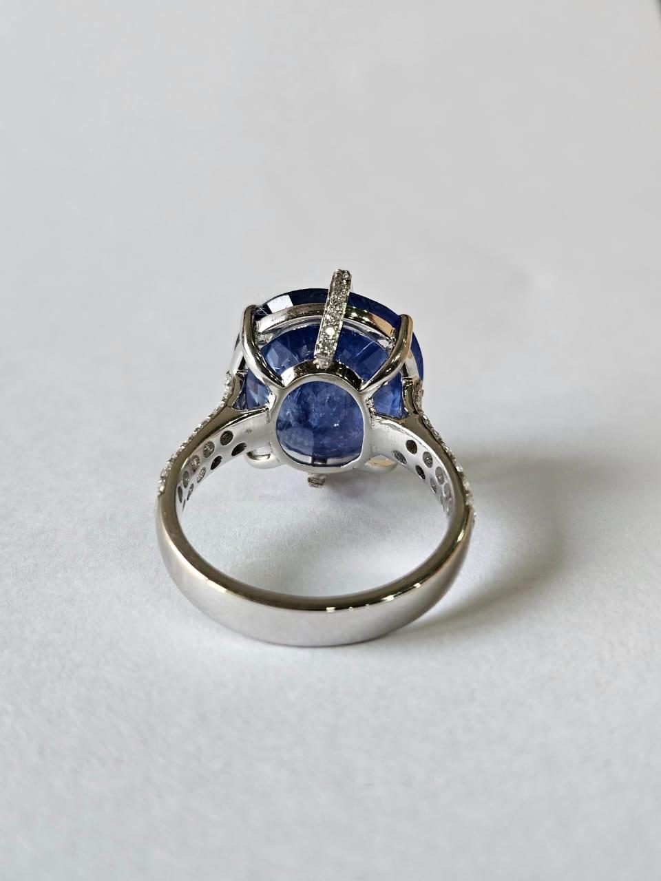 A very gorgeous and beautiful, one of a kind, modern style, Blue Sapphire Cocktail Engagement Ring set in 18K  White Gold & natural Diamonds. The weight of the Blue Sapphire is 13.38 carats. The Blue Sapphire is of Ceylon (Sri Lankan) origin. The