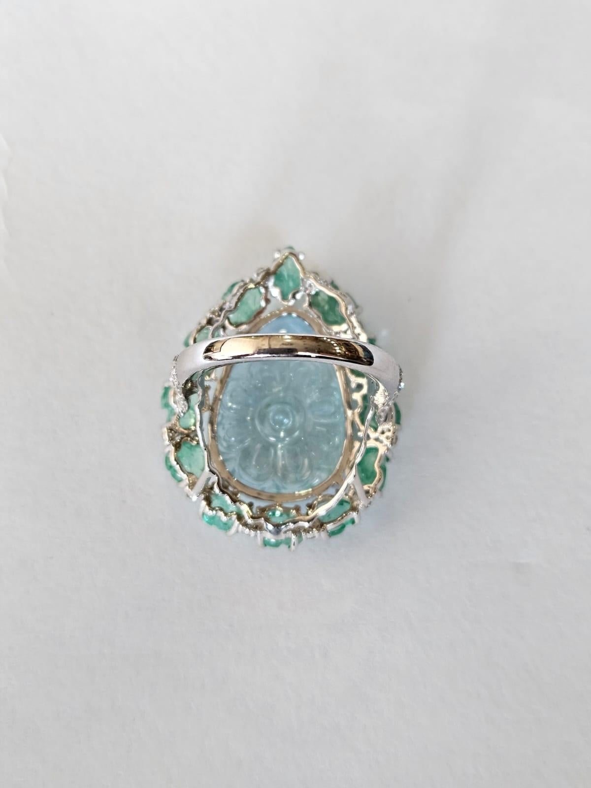 Modern Set in 18K Gold, 13.39 carats carved Aquamarine, Emerald & Diamond Cocktail Ring For Sale