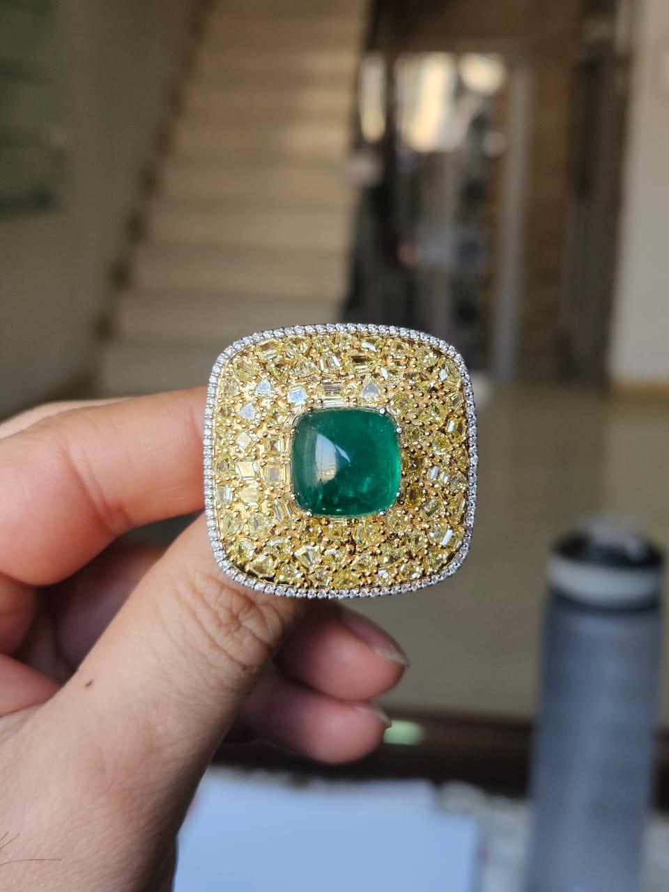 A very gorgeous and beautiful, modern style, Emerald Sugarloaf Cocktail Dome Ring set in 18K Gold & natural Diamonds. The weight of the Emerald is 13.48 carats. The Emerald Sugarloaf is completely natural, without any treatment and is of Zambian