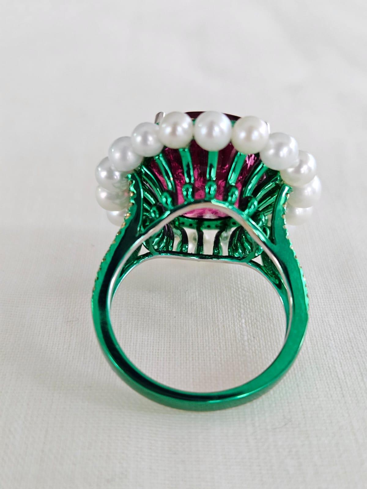A very gorgeous and one of a kind, Tourmaline & Pearl Engagement Cocktail Ring set in 18K Gold & Diamonds. The weight of the Tourmaline is 13.61 carats. The weight of the Pearl is 7.12 carats. The Diamonds weight is 0.39 carats. Net 18K Gold weight