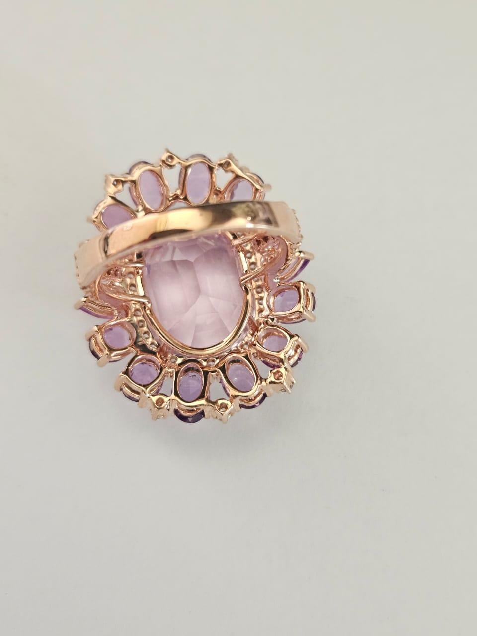 A very gorgeous and beautiful, Kunznite & Pink Sapphires Cocktail Ring set in 18k Rose Gold & natural Diamonds. The weight of the Kunzite is 13.75 carats. The weight of the Pink Sapphires is 4.38 carats. The Pink Sapphires are of Ceylon (Sri Lankan)