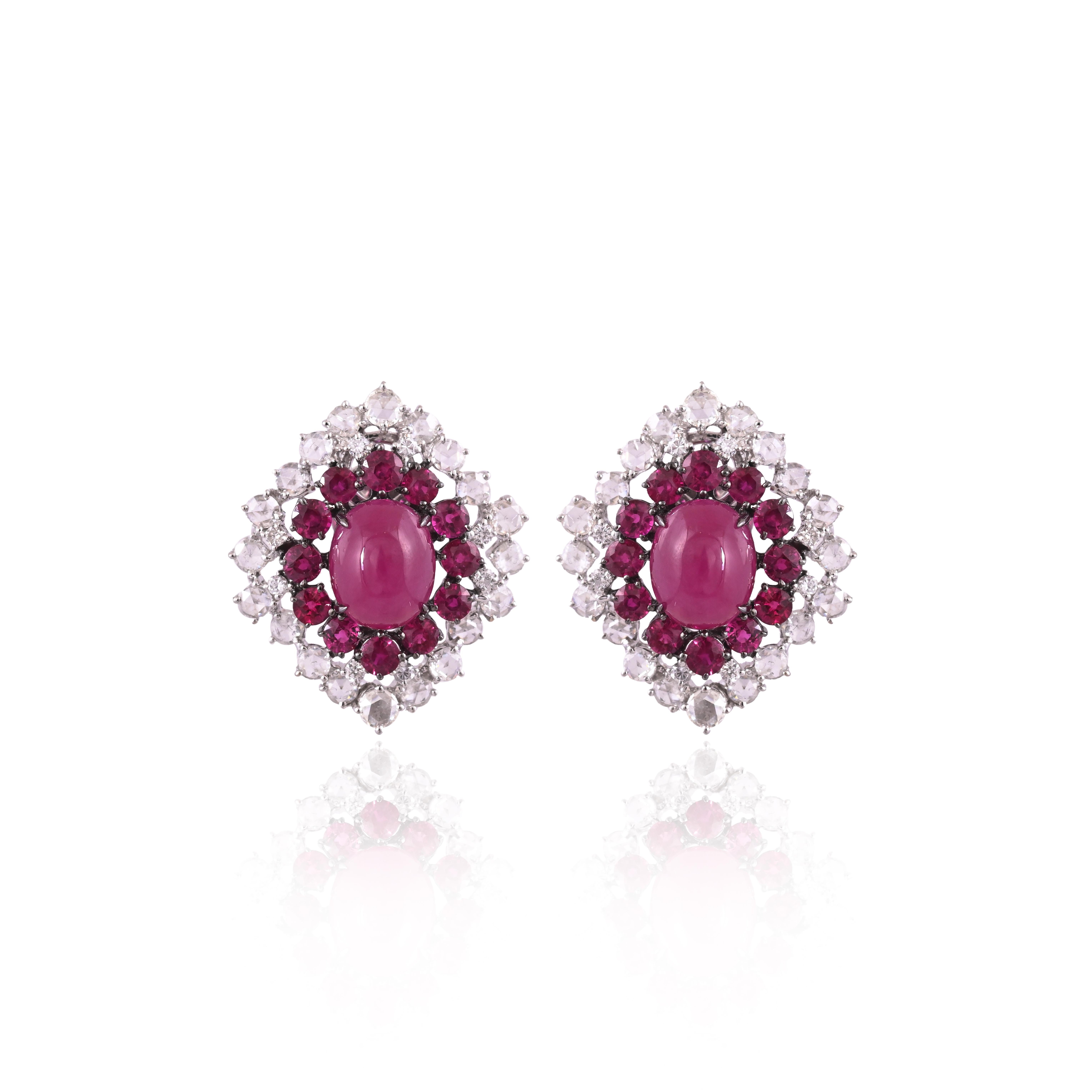A very gorgeous and beautiful, Ruby Stud Earrings set in 18K White Gold & natural Diamonds. The combined weight of the Rubies is 13.87 carats. The Diamonds weight is 2.45 carats. Net 18K Gold weight is 9.90 grams. The Gross weight of the Earrings is