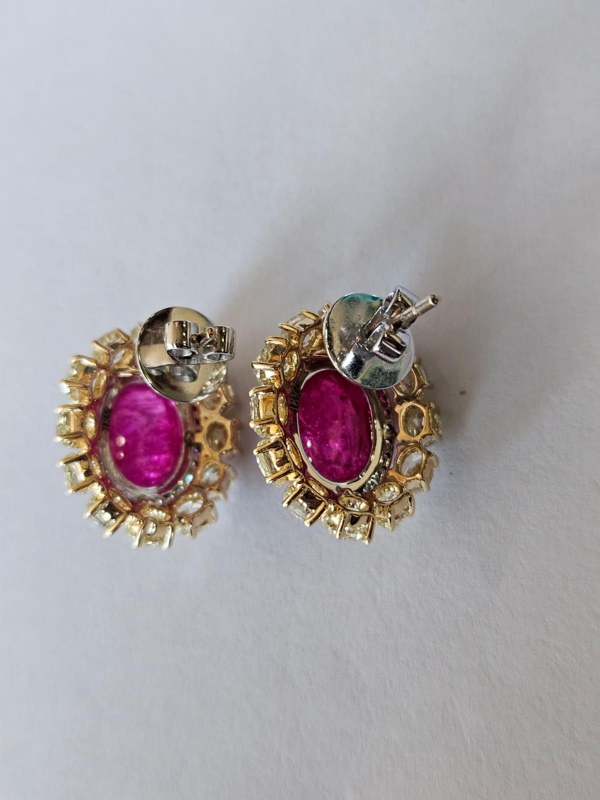 A very gorgeous and beautiful, Ruby Stud Earrings set in 18K Gold & natural Diamonds. The weight of the Ruby Cabochons is 13.98 carats. The Rubies are completely natural, without any treatment and are of Burmese origin. The combined Diamonds weight