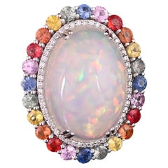 Set in 18K Gold, 14.70 Carat Opal, Multi Sapphires
Diamonds Cocktail Ring Set in 18K Gold, 14.70 Carat Opal, Multi Sapphires
Diamonds Cocktail Ring