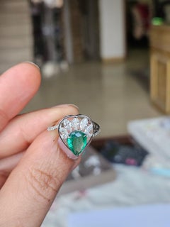 Set in 18K Gold, 1.66 carats, natural Zambian Emerald & Diamonds Engagement Ring