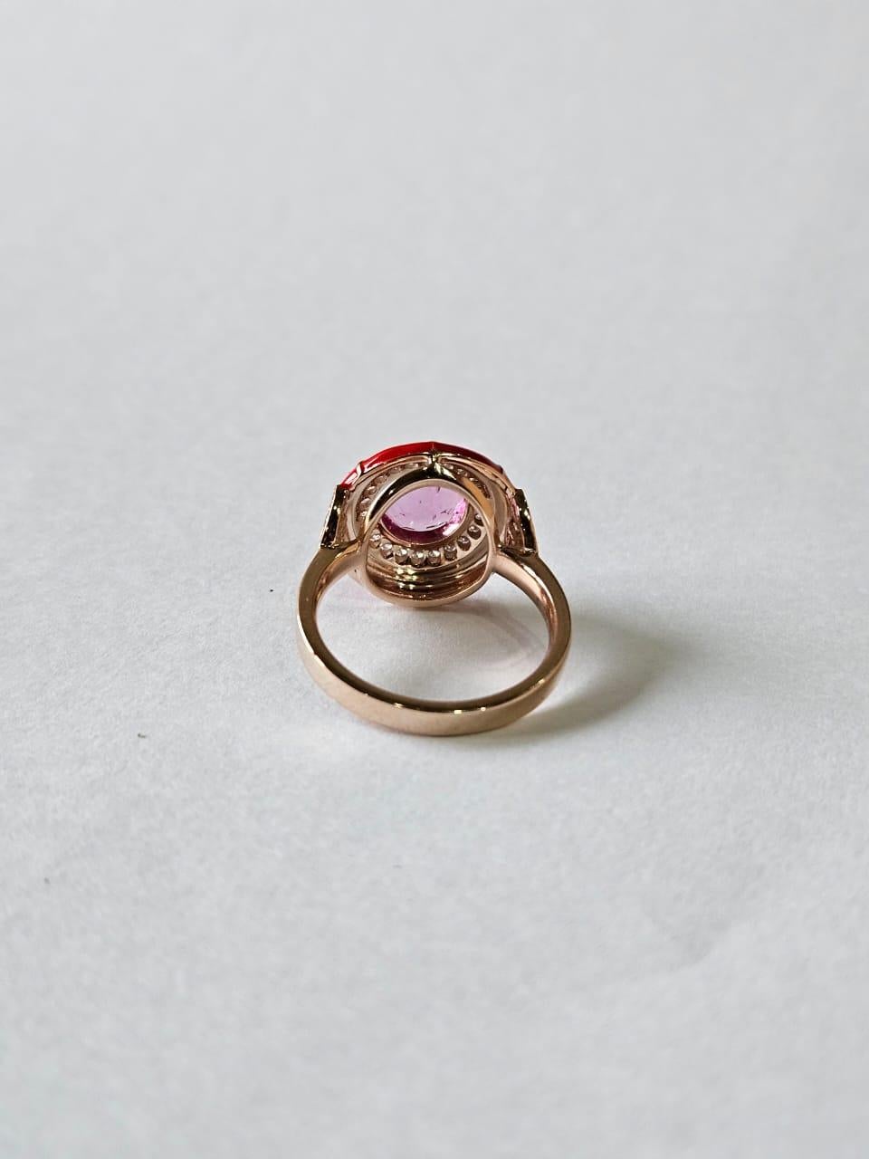 A very gorgeous and beautiful, one of a kind, Pink Sapphire & Orange Enamel Cocktail Engagement Ring set in 18K Gold & natural Diamonds. The weight of the Pink Sapphire is 1.76 carats. The Pink Sapphire is of Ceylon (Sri Lankan) origin. The Enamel