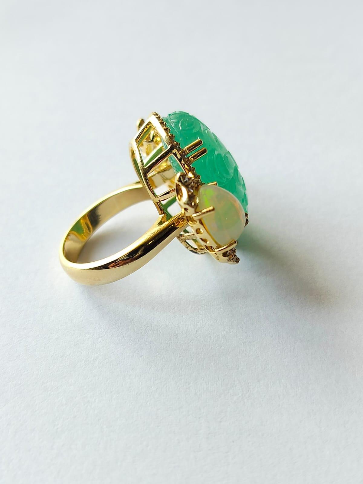 Art Deco Set in 18K Gold 18.22 carat carved Russian Emerald, Opal & Diamond Cocktail Ring For Sale