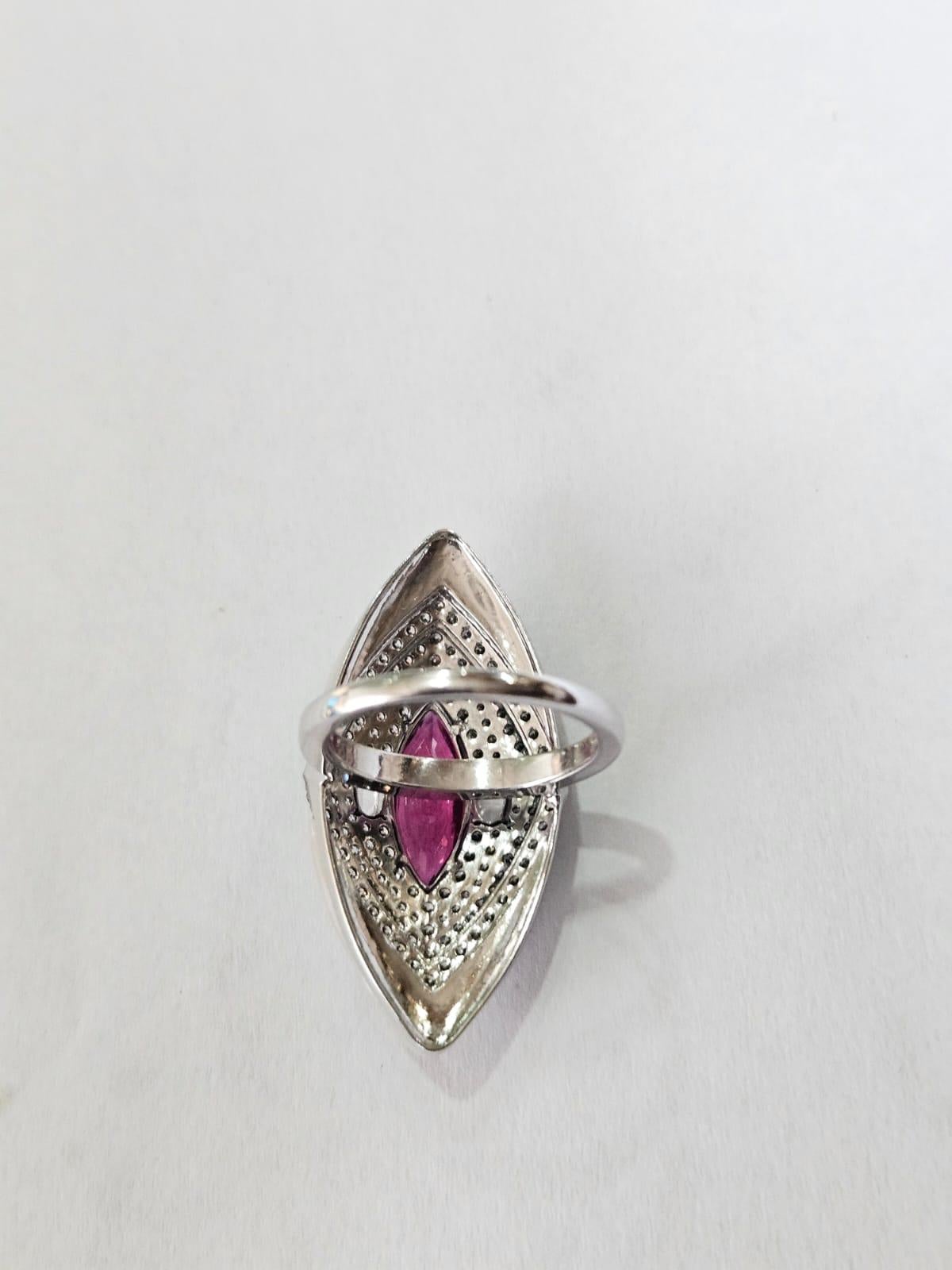 A very beautiful and unique, Art Deco style Rubellite & Pink Opal Cocktail Ring set in 18K White Gold & natural Diamonds. The weight of the Rubellite is 1.99 carats. The weight of the Pink Opals is 2.08 carats. The combined Diamonds weight is 1.56