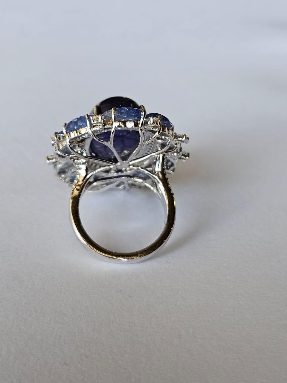 Art Deco Set in 18K Gold, 20.95 carats Tanzanite, Blue Sapphire & Diamonds Cocktail Ring For Sale