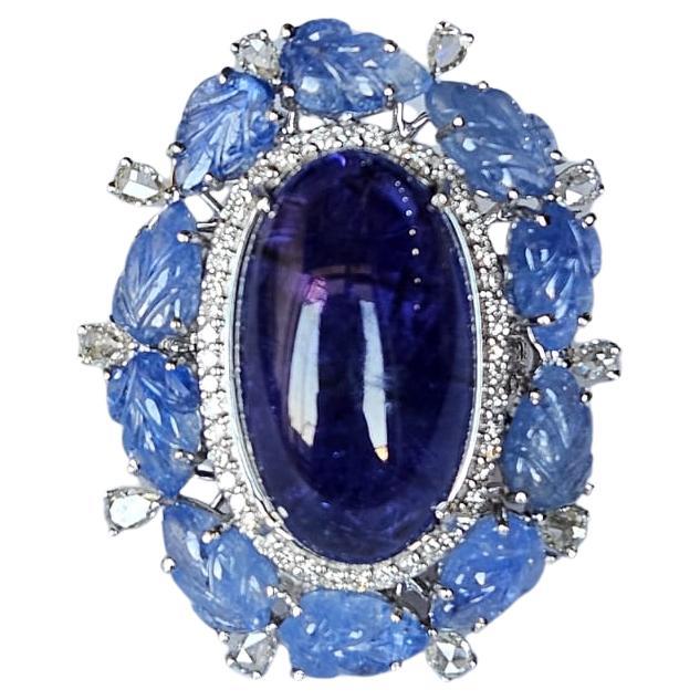 Set in 18K Gold, 20.95 carats Tanzanite, Blue Sapphire & Diamonds Cocktail Ring For Sale