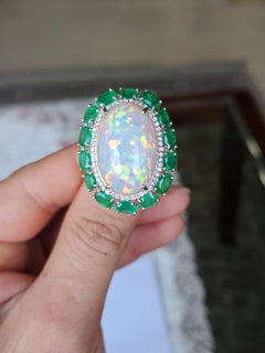 Set in 18K Gold, 21.06 carats Ethiopian Opal, Emeralds & Diamonds Cocktail Ring