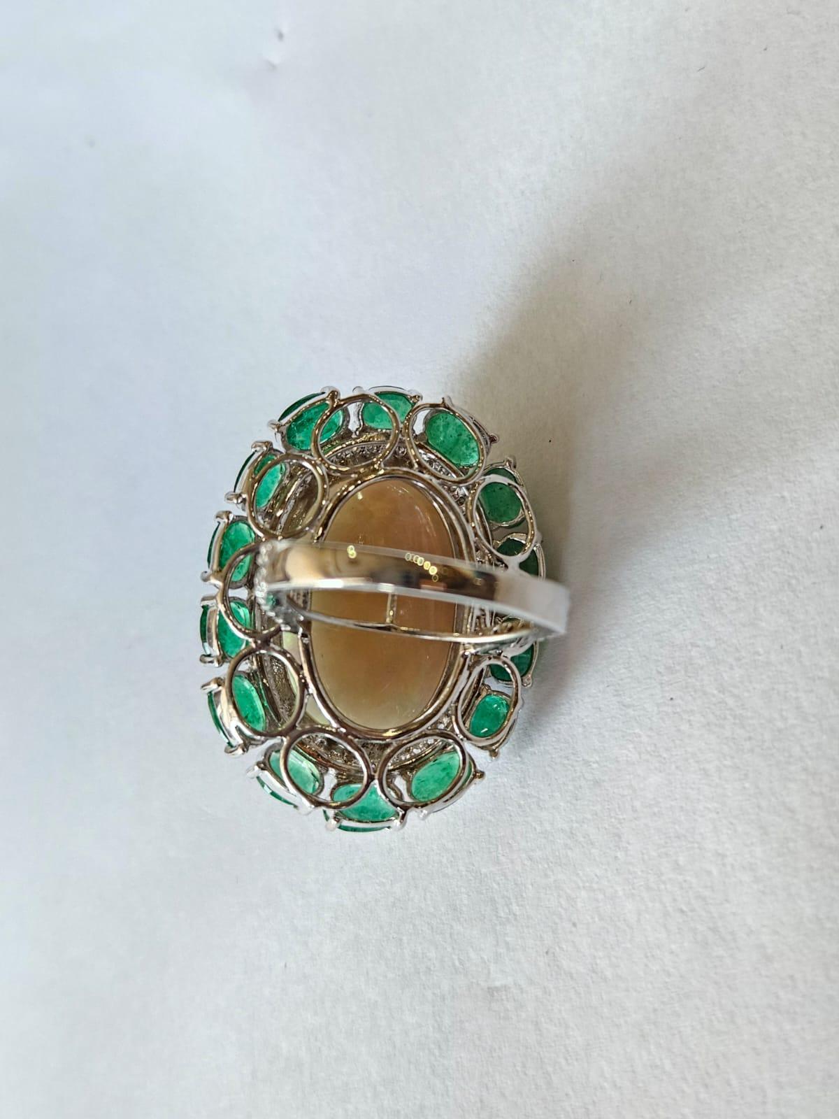 Modern Set in 18K Gold, 21.06 carats Ethiopian Opal, Emeralds & Diamonds Cocktail Ring For Sale