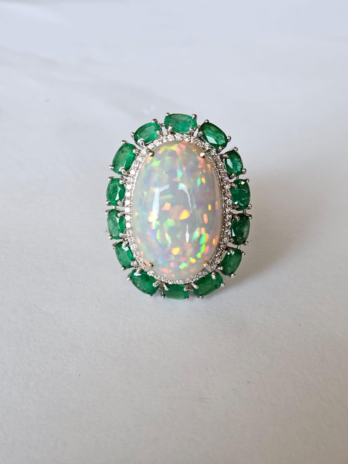 Set in 18K Gold, 21.06 carats Ethiopian Opal, Emeralds & Diamonds Cocktail Ring In New Condition For Sale In Hong Kong, HK
