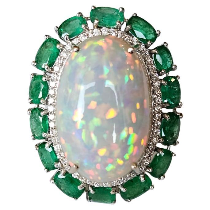 Set in 18K Gold, 21.06 carats Ethiopian Opal, Emeralds & Diamonds Cocktail Ring