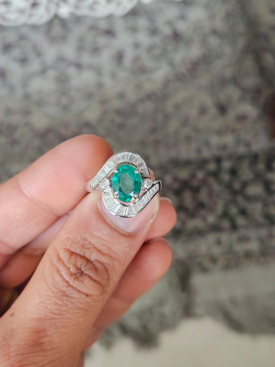 A very gorgeous and beautiful, Emerald Engagement Ring set in 18K Gold White Gold & natural Diamonds. The weight of the Emerald is 2.14 carats. The Emerald is completely natural, without any treatment and is of Zambian origin. The Diamonds weight is