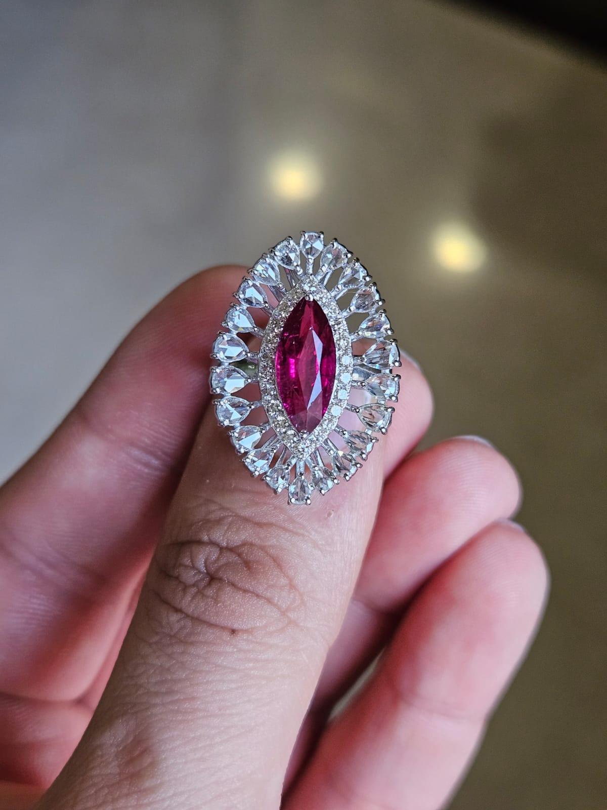A very gorgeous and beautiful, Rubellite Cocktail Engagement Ring set in 18K White Gold & natural Diamonds. The weight of the Rubellite is 2.17 carats. The combined Diamonds weight is 1.33 carats. Net 18K Gold weight is 5.49 grams. The Gross weight