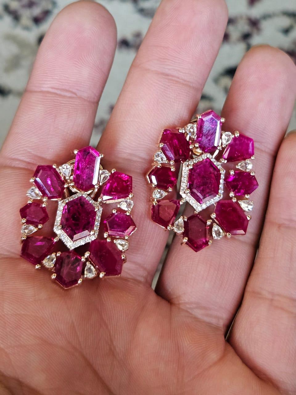 A very gorgeous and beautiful, Ruby Stud Earrings set in 18K Rose Gold & Diamonds. The weight of the shield shaped Rubies is 21.78 carats. The Rubies are completely natural, without any treatment & is of Mozambique origin. The combined Diamonds