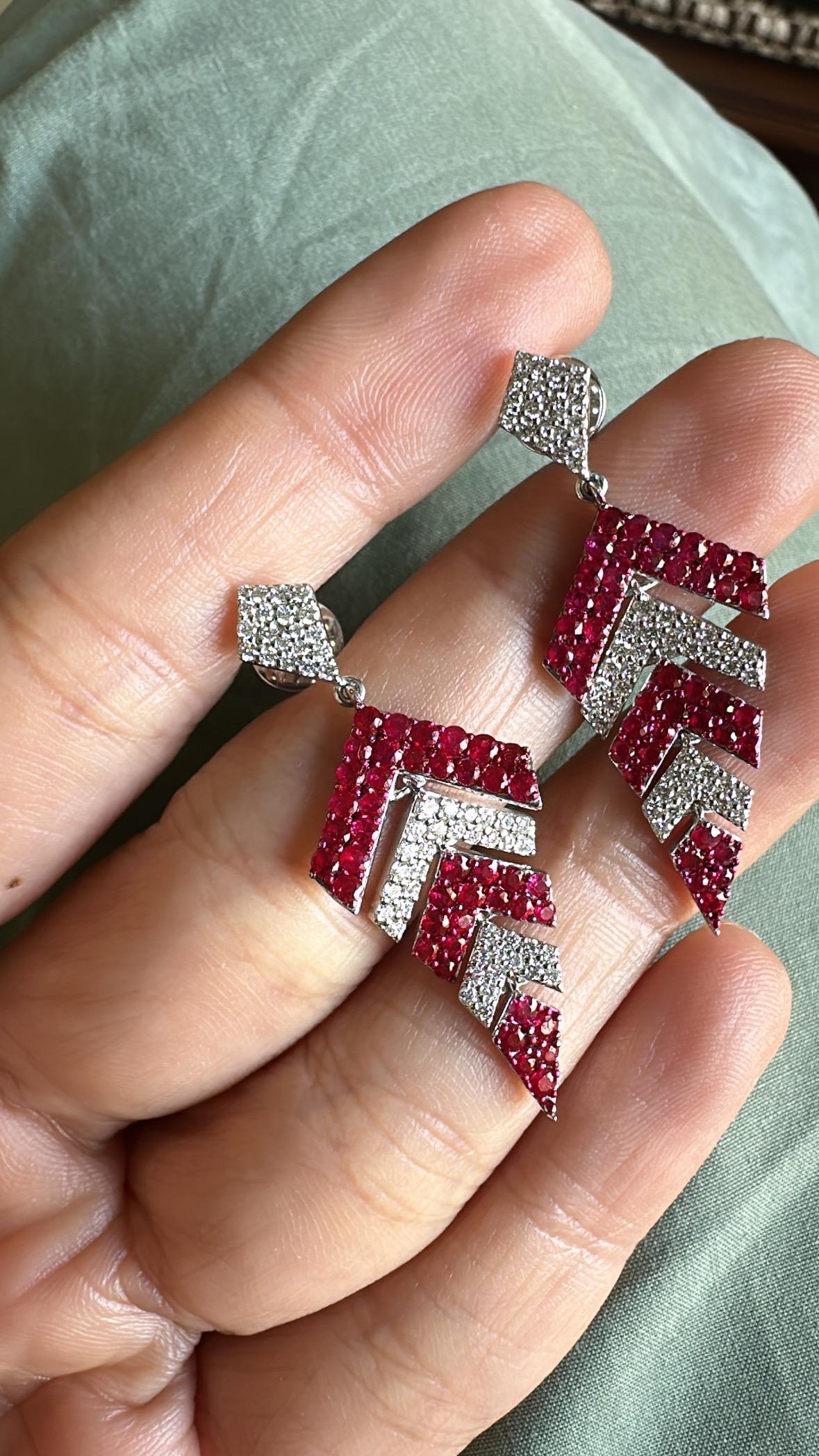 A very gorgeous and beautiful, modern style, Ruby Chandelier Earrings set in 18K White Gold & natural Diamonds. The weight of the Rubies is 2.18 carats. The Diamonds weight is 0.81 carats. Net 18K Gold weight is 8.00 grams. The Gross weight of the