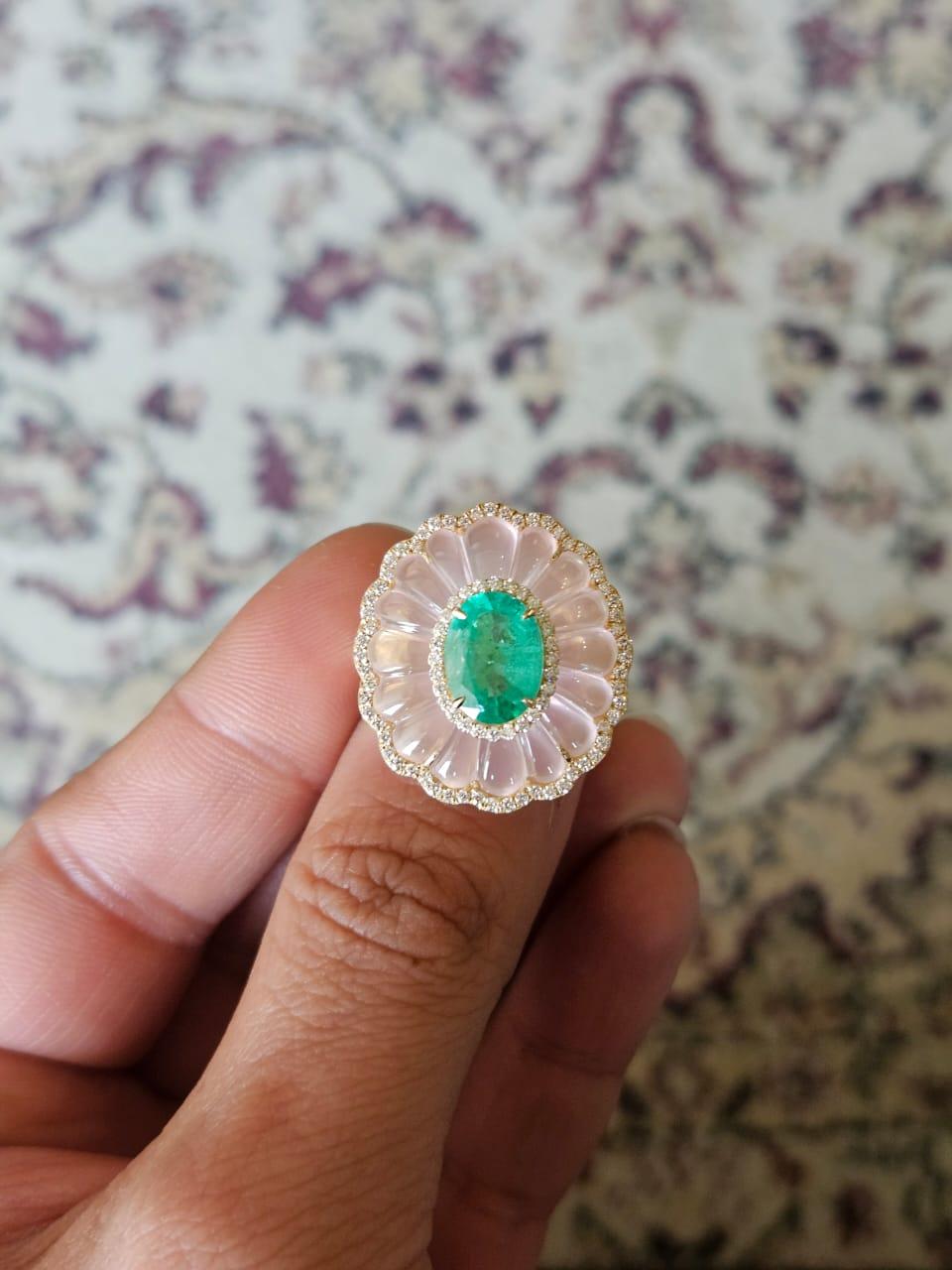 A very beautiful, Emerald & Rose Quartz Cocktail Ring set in 18K  Rose Gold & Diamonds. The weight of the Emerald is 2.28 carats. The Emerald is completely natural, without any treatment  and is of Zambian origin. The weight of the Rose Quartz is