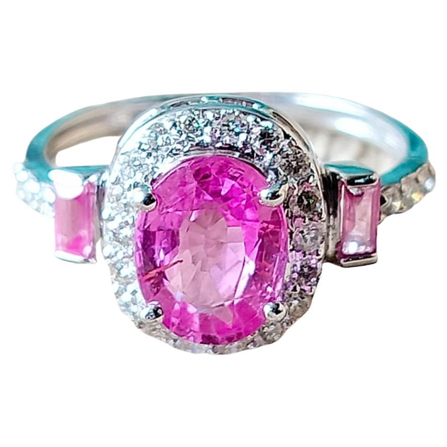 A very gorgeous and beautiful, Pink Sapphire Engagement Ring set in 18K Gold & Diamonds. The weight of the Pink Sapphire is  2.32 carats. The Sapphire is of Ceylon origin. The Diamonds weight is 0.38 carats. Net 18K Gold weight is 2.81 grams. The