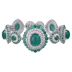 Set in 18K Gold, 23.49 carats Colombian Emerald Cabochons & Diamonds Bracelet