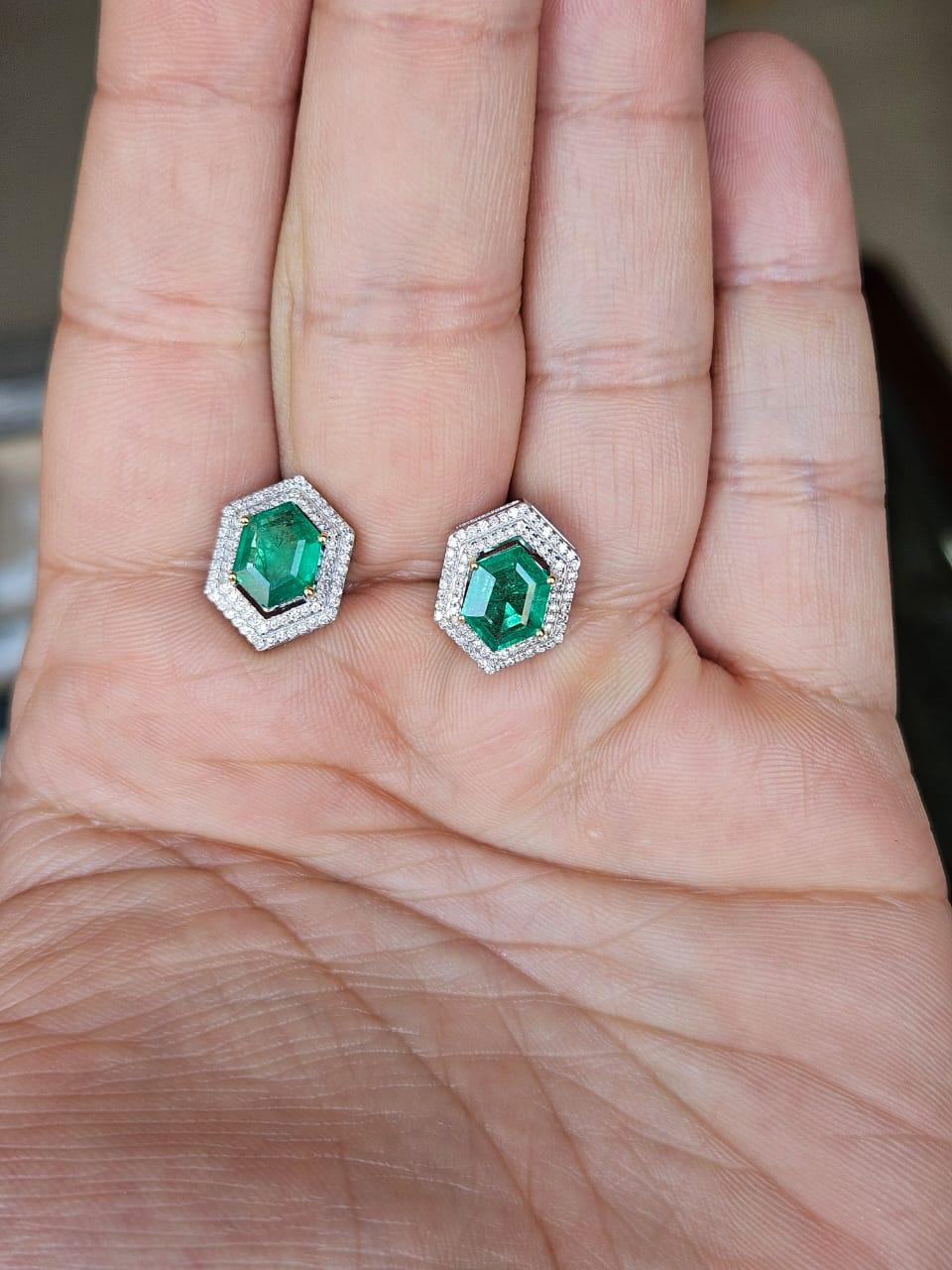 A very gorgeous and beautiful, modern style, Emerald Stud Earrings set in 18K White Gold & natural Diamonds. The weight of the Hexagon shaped Emeralds is 2.42 carats. The Emeralds are completely natural, without any treatment and are of Zambian