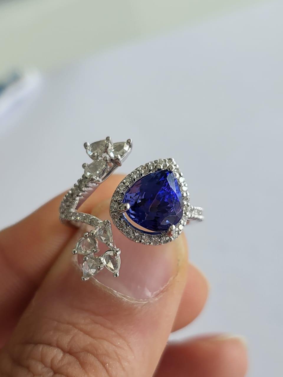 A very gorgeous and beautiful, Tanzanite Cocktail / Engagement Ring set in 18K White Gold & Diamonds. The weight of the pear shaped Tanzanite is 2.68 carats. The Tanzanite is completely natural and responsibly sourced from Tanzania. The weight of