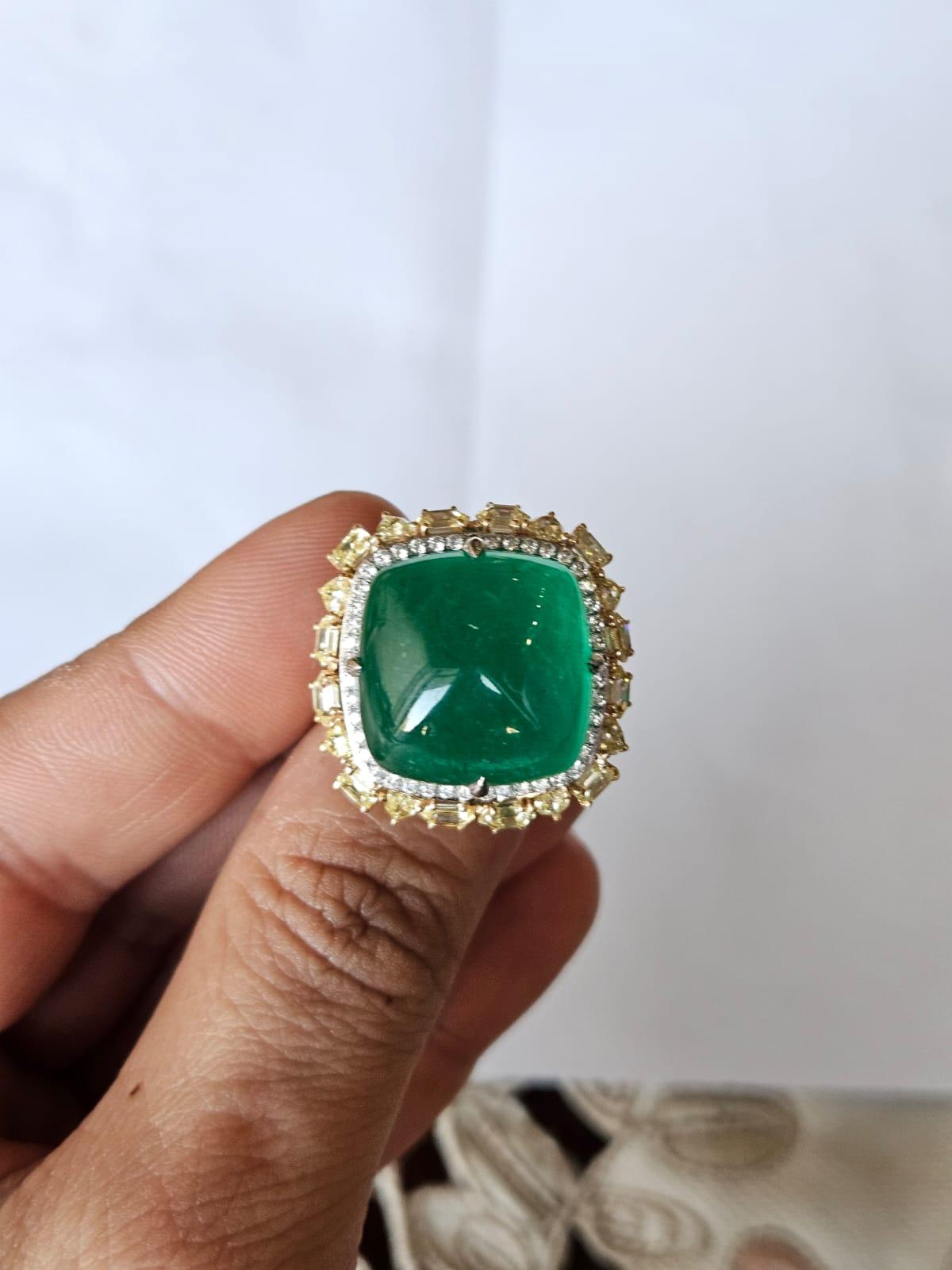 A very gorgeous and beautiful, Emerald Cocktail Dome Ring set in 18K White Gold & natural Diamonds. The wight of the Emerald cabochon is 27.74 carats. The Emerald is completely natural, without any treatment and is of Zambian origin. The combined
