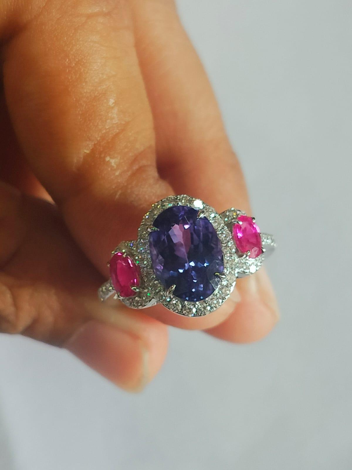 Oval Cut Set in 18K Gold, 2.90 carats Tanzanite, Pink Sapphire & Diamond Engagement Ring  For Sale