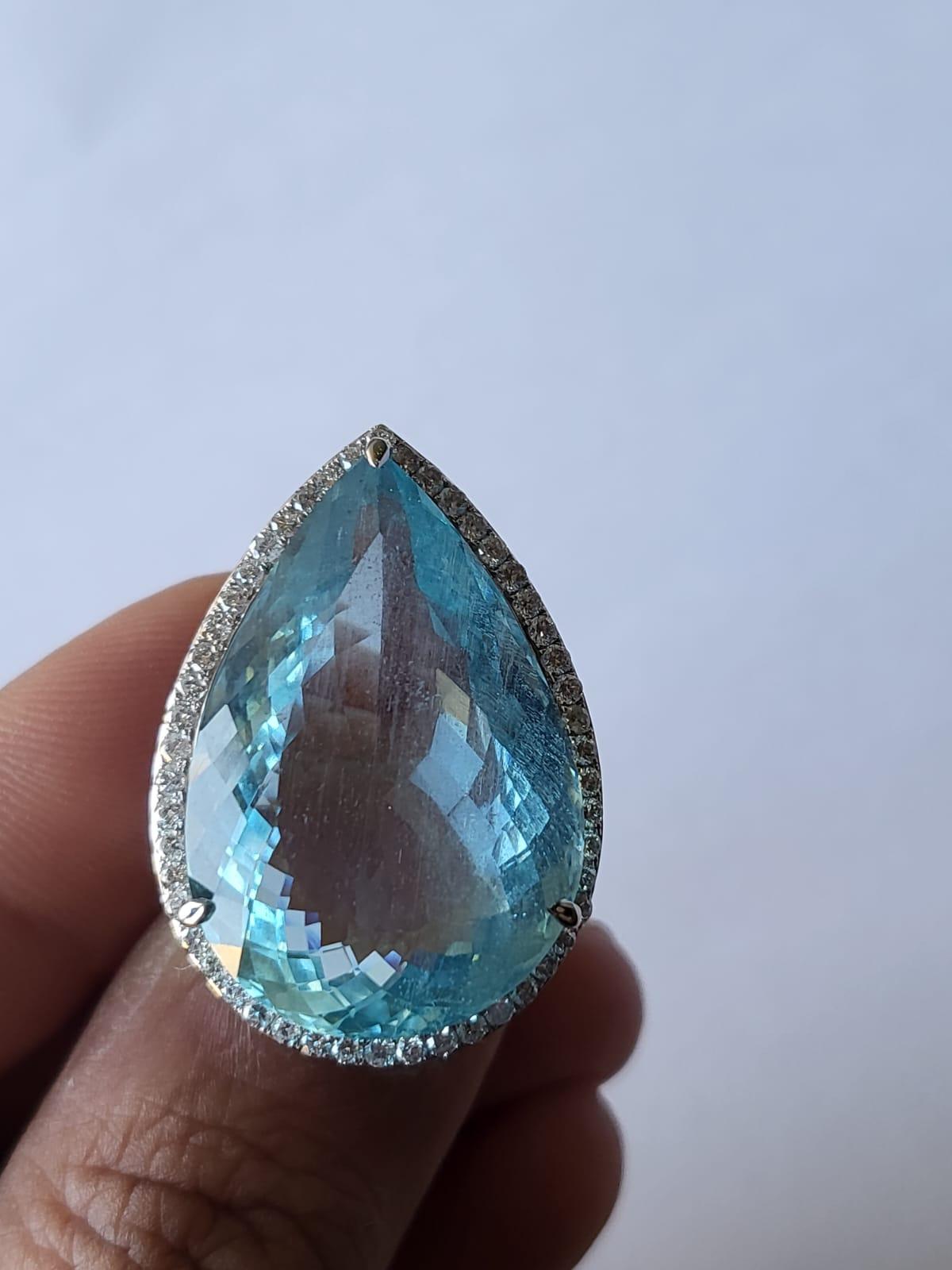 An exceptionally rare and one of a kind, Aquamarine Engagement / Cocktail Ring set in 18K White Gold & Diamonds. The weight of the pear shaped Aquamarine is 31.25 carats. The weight of the Diamonds is 0.96 carats. Net Gold weight is 7.91 grams. The