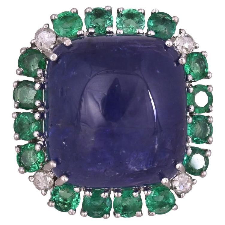 Set in 18K Gold, 32.53 carat Tanzanite cabochon, Emerald & Diamond Cocktail Ring