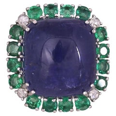 Set in 18K Gold, 32.53 carat Tanzanite cabochon, Emerald & Diamond Cocktail Ring