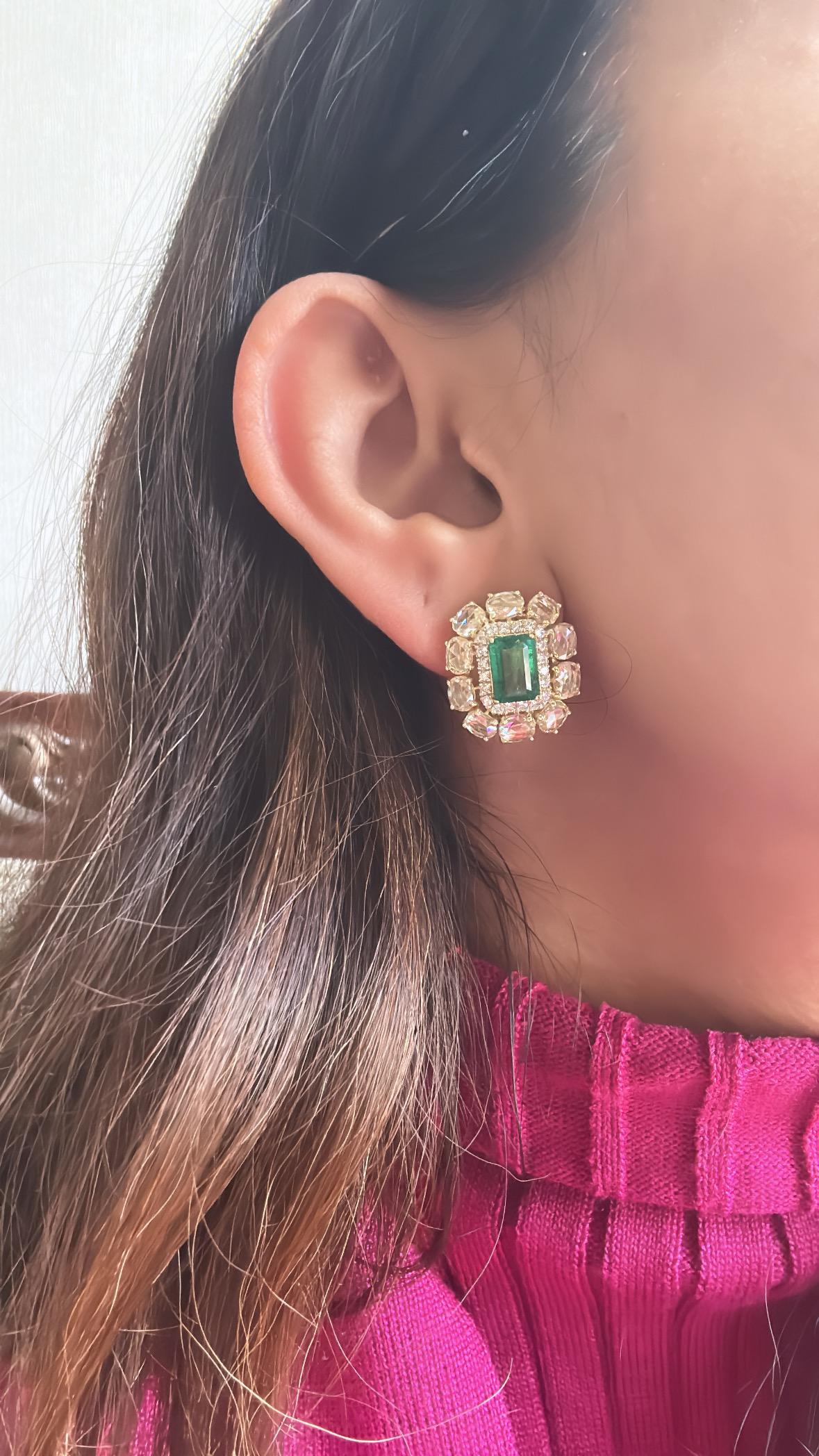 A very gorgeous and beautiful, modern style, Emerald Stud Earrings set in 18K Gold & Diamonds. The weight of the Emeralds is 3.41 carats. The Emeralds is completely natural, without any treatment and is of Zambian origin. The combined Diamonds