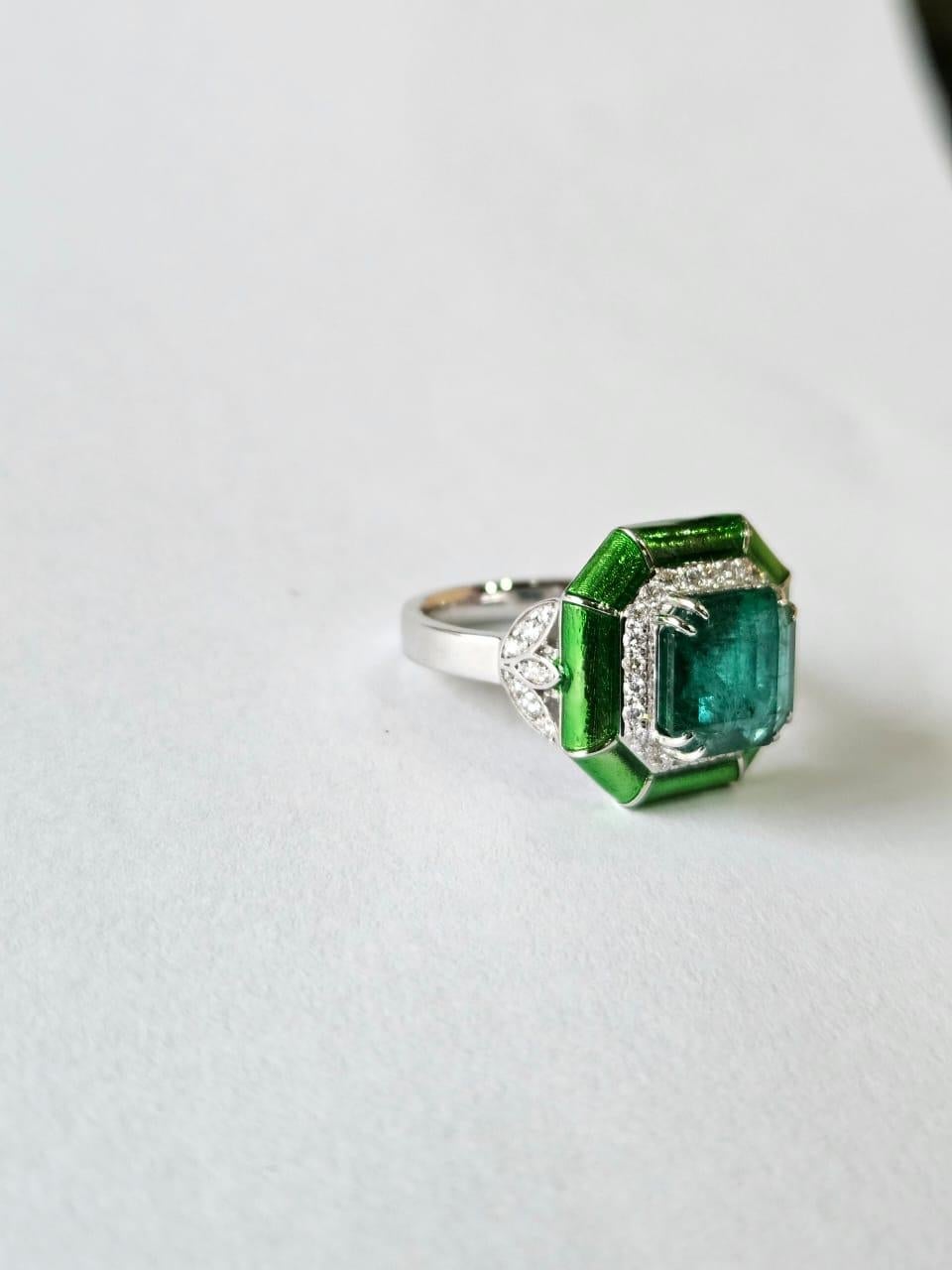 A very stunning and gorgeous, Emerald & Enamel Engagement Cocktail Ring set in 18K White Gold & natural Diamonds. The weight of the Emerald is 3.47 carats. The Emerald is completely natural, without any treatment and is of Zambian origin. The weight