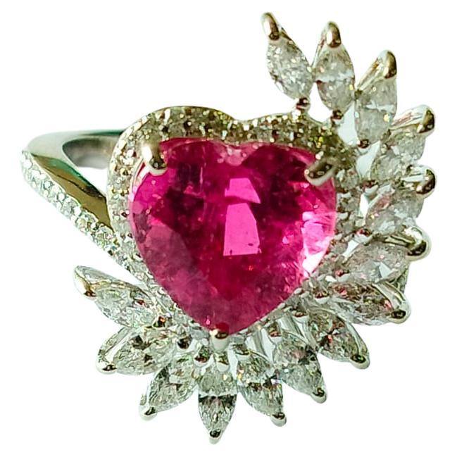 A classic art-deco style Rubellite Engagement/ Cocktail ring set with 18K Gold and Diamonds. The weight of the heart shaped Rubellite is 3.51 carats. The combined weight of the diamonds is 1.07 carats. Net 18K Gold weight is 5.251 grams. The Gross