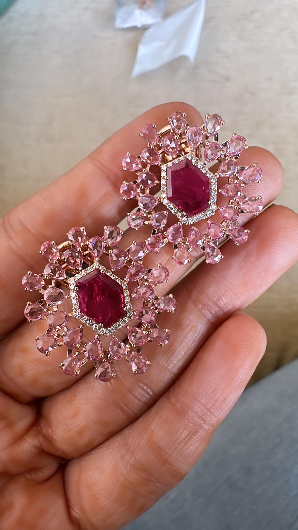 A very gorgeous and beautiful, Ruby and Pink Sapphire Stud Earrings set in 18K Rose Gold & Diamonds. The weight of the Rubies is 3.53 carats. The Rubies are completely natural, without any treatment & are of Mozambique origin. The weight of the Pink