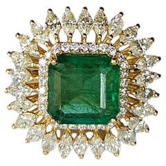 Set in 18K Gold, 3.67 carats, Zambian Emerald 
Marquise Diamonds Cocktail Ring
