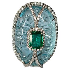 Set in 18K Gold, 38.09 carats carved Aquamarine, Emerald & Diamond Cocktail Ring