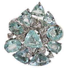 Set in 18K Gold, 3.98 carats, Paraiba Tourmalines & Diamonds Engagement Ring