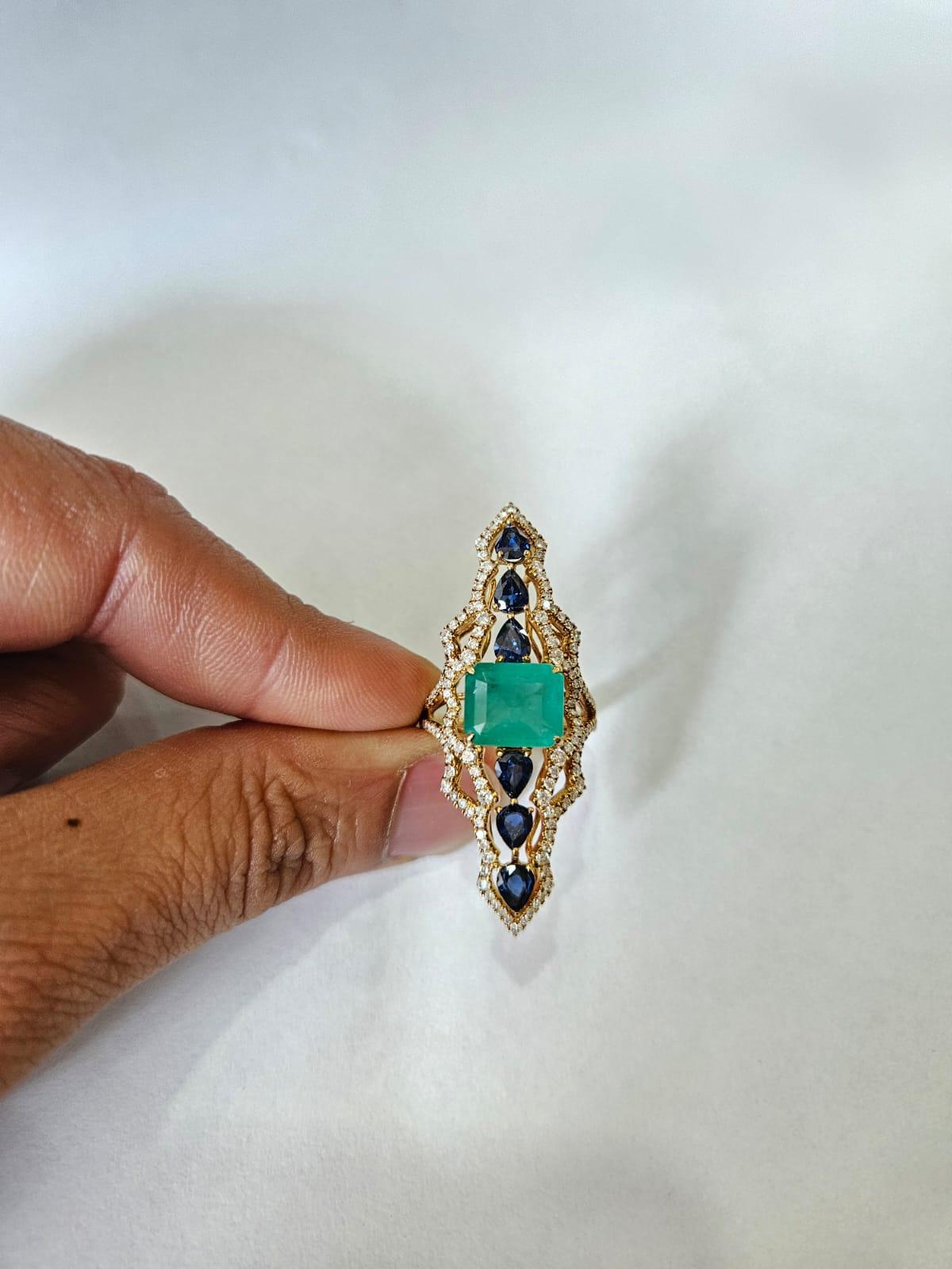 Emerald Cut Set in 18K Gold, 3.99 carats Emerald, Blue Sapphires & Diamonds Cocktail Ring For Sale