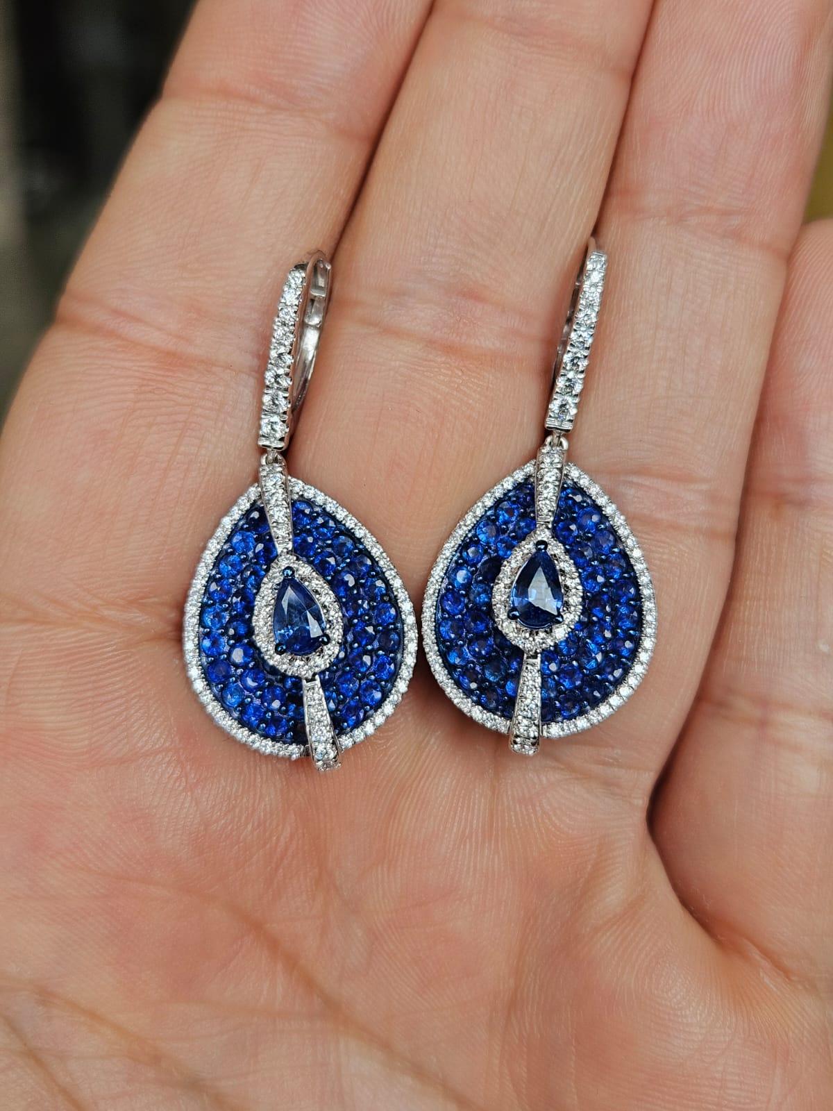 A very gorgeous and beautiful, modern style, Blue Sapphires Dangle Earrings set in 18K White Gold & natural Diamonds. The weight of the Blue Sapphires is 4.02 carats. The Blue Sapphires are of Ceylon (Sri Lankan origin. The Diamonds weight is 0.83