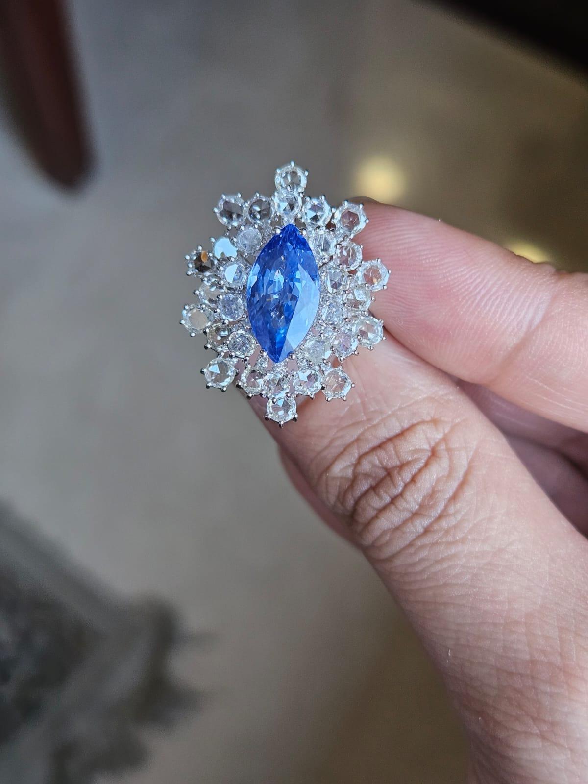 A very gorgeous and beautiful, Blue Sapphire Engagement Cocktail Ring set in 18K White Gold & natural Diamonds. The weight of the Blue Sapphire is 4.05 carats. The Blue Sapphire is of Ceylon (Sri Lankan) origin. The Diamonds weight is 3.34 carats.