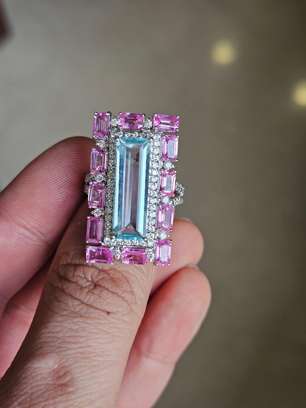 A very gorgeous and beautiful, modern style, Aquamarine & Pink Sapphire Cocktail Ring set in 18K White Gold & natural Diamonds. The weight of the Aquamarine is 4.33 carats. The weight of the Pink Sapphires is 3.86 carats. The Pink Sapphires are of